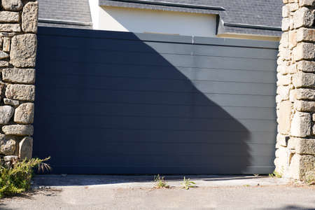 portal facade aluminum sliding gray metal gate of modern gray suburb house entrance
