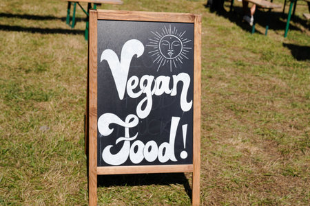 vegan food panel drawing with chalk on a blackboard for restaurant food truck cookの写真素材