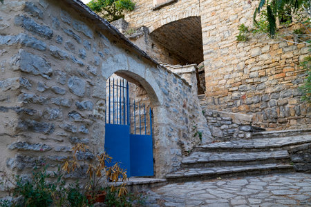 metallic classic blue steel vintage metal arch stone house gate access property in medieval cityの写真素材