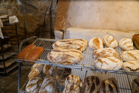 Assortment of baked bread traditional on rustic retro bakery shop