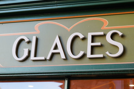 french text means ice cream sign facade store front of wall shopの写真素材