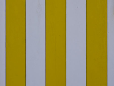 Yellow and white line wooden boards colored vertical planks background for bannerの写真素材