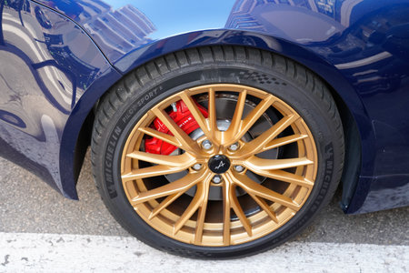 Bordeaux , Aquitaine France - 10 10 2022 : Alpine A110 sports car golden front wheel modern Renault...