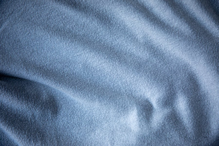 Abstract gray fabric with soft wave texture pleated cotton fabric backgroundの写真素材