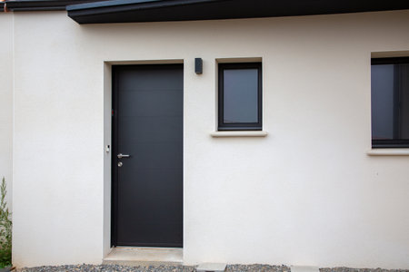 modern white house garage door of street suburban homeの写真素材