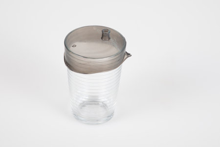 gray plastic round lid Protect Your Glass cover in partsの写真素材