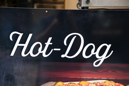 hot dog fast food restaurant text sign on wall facade entrance in streetのeditorial素材