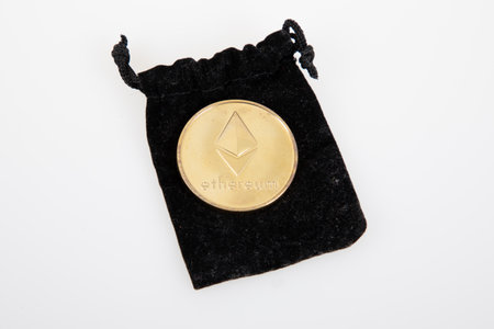 Bordeaux , Aquitaine France - 28 12 2022 : Ethereum gold coin Cryptocurrency on felt bag on white backgroundのeditorial素材