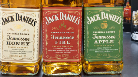 Bordeaux , Aquitaine France - 28 12 2022 : jack daniel's whiskey tenessee honey fire apple logo sign and brand text honey cinnamon apple liqueur bottles jack danielsのeditorial素材