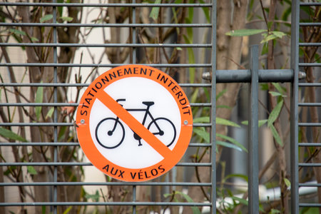 parking prohibited aux velos french text sign means parking prohibited for bicycle prohibited traffic sign No bike no parking wall panel in cityの写真素材