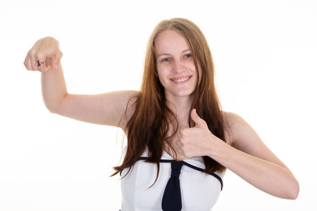happy woman thumbs up arm gesture smiles isolated over white backgroundの写真素材