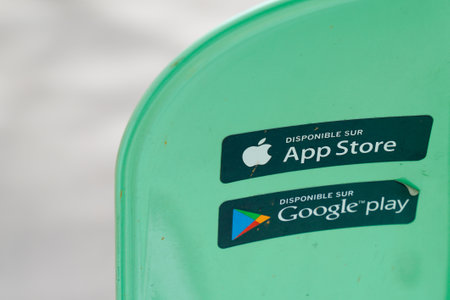 Bordeaux , Aquitaine France - 09 02 2023 : google play and apple app store logo brand and sign text on flag in street front shopのeditorial素材