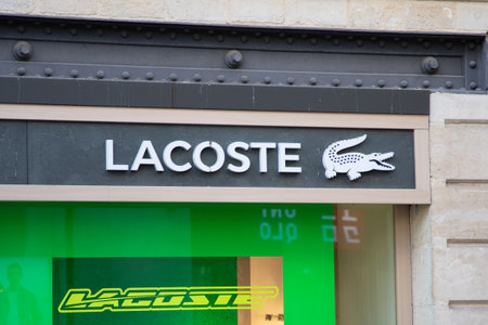 Bordeaux , Aquitaine France - 12 02 2023 : lacoste logo brand fashion shop and text sign store green facade boutique french chain of luxury polo sporty clothesのeditorial素材