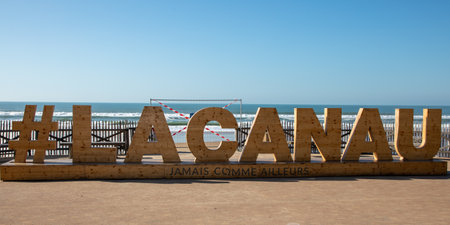 lacanau , Aquitaine France - 12 02 2023 : lacanau town ocean wooden text logo #lacanau number sign hash pound sign brand of french surf city south west atlantic coast in Franceのeditorial素材