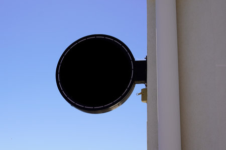 Empty round black mockup blank shop sign in street cityの写真素材