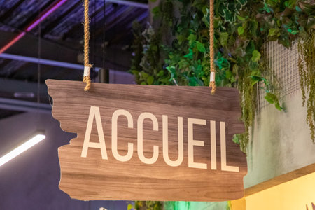 accueil in french text panel means welcome entry sign on wooden plankの写真素材