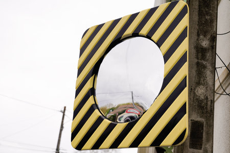 street traffic convex mirror for car view in road safety conceptの写真素材