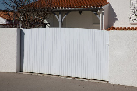 white modern plastic home gate portal polyvinyl chloride with panel blades in city suburbs house...