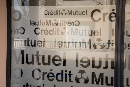 Bordeaux , Aquitaine France - 03 15 2023 : Credit Mutuel windows facade sign text and logo brand on bank office entrance agencyのeditorial素材