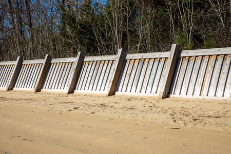 wooden breakwater erosion wall groyne sea on the beach