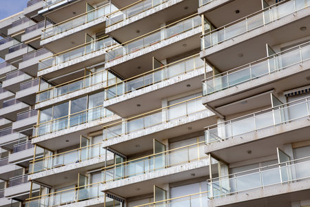 facade apartment building with glass balconies in modern architecture houses large glazing balconyの写真素材