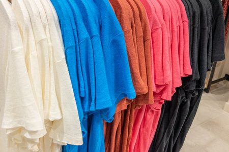 Shopping background with several shirt T-shirt at market Summer fashion female clothes in shop