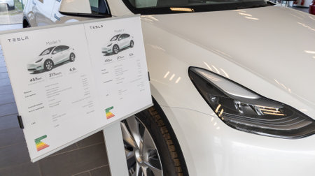 Bordeaux , Aquitaine France - 03 31 2023 : Tesla store car with model y sale specification panel...