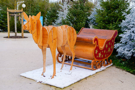 wooden sleigh with reindeer in street front pine tree for children christmas celebrationの写真素材