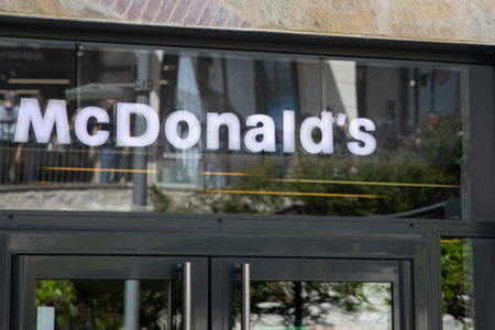 Bordeaux , Aquitaine France - 04 17 2023 : McDonald's sign text and brand logo on windows facade...