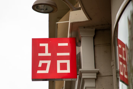 lyon , Aura France - 04 27 2023 : Uniqlo logo brand and text facade chain sign store clothes shop...