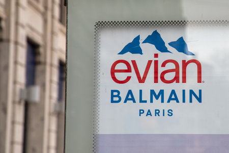 Bordeaux , Aquitaine France - 02 27 2023 : Evian Natural Mineral Water logo text and Balmain paris sign brand in french advertisingのeditorial素材