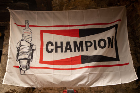 Bordeaux , Aquitaine France - 05 02 2023 : champion spark plugs logo brand and text sign on old advertising flag vintage carのeditorial素材