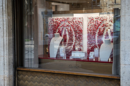 lyon , Aura France - 05 01 2023 : Cartier logo sign and brand text front windows facade boutique fine jewelry watchesのeditorial素材