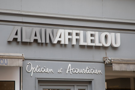 Bordeaux , Aquitaine France - 05 09 2023 : alain afflelou logo brand and text sign wall facade of french store street optic Optician medical glasses shopのeditorial素材