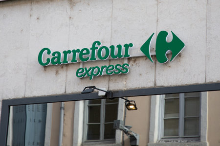 lyon , Aura France - 04 20 2023 : carrefour express text brand and logo sign on wall chain facade town store entrance shop small supermarketのeditorial素材