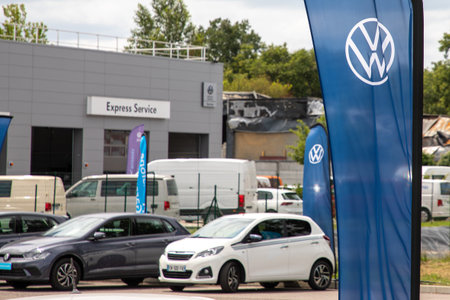 Bordeaux , France - 06 27 2023 : vw flag sign text and brand logo car front of vehicle blurry building express service dealership Volkswagen Signage parkのeditorial素材