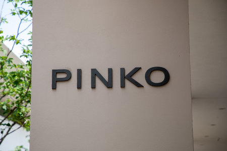 Milan , Italy - 07 10 2023 : pinko facade chain logo brand and text sign at entrance of fashionable textile store of fashion commercial clothing boutiqueのeditorial素材