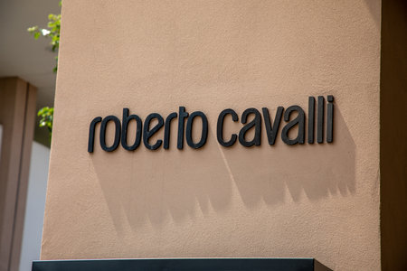 Milan , Italy - 07 25 2023 : Roberto Cavalli logo sign chain and brand text on store facade fashion clothing shop entranceのeditorial素材