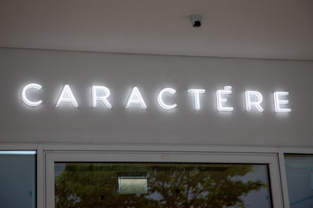 lyon , France - 08 30 2023: caractere facade shop logo brand and text sign store fashion signage on wall entrance boutiqueのeditorial素材