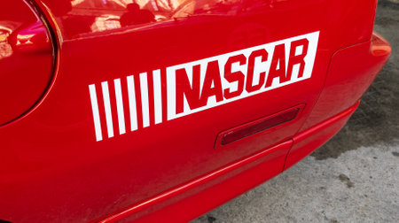 Daytona Beach, USA - 09 06 2023: nascar logo brand and text sign on side racing sport car in circuit...