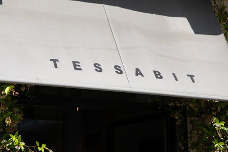 Milan , Italy - 08 29 2023 : tessabit sign text facade shop and logo brand store on entrance...