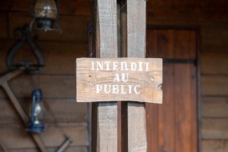 forbidden to the public french sign text on wooden board means forbidden to the public front wood house no access limitの写真素材