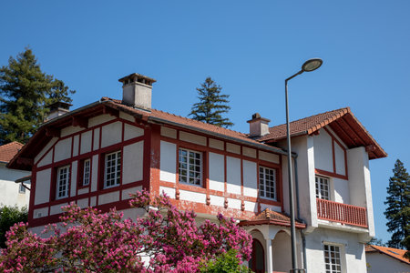 typical bask house facade white red in Bayonne city SouthWest of Franceのeditorial素材