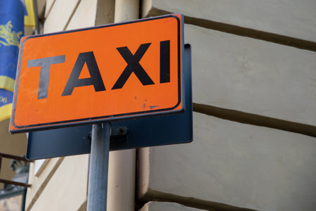 taxi sign road signage text street sign indicating the stopping and waiting station for car taxisの写真素材