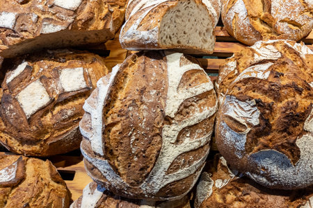 Freshly baked traditional bread in shop baker display classic french breadの写真素材