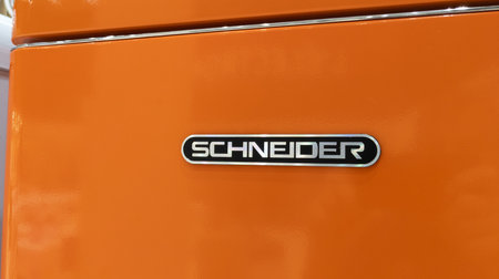 Bordeaux , France - 12 06 2023: Schneider Electric logo brand signage on orange fridge facade...