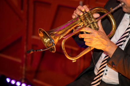 man playing trumpet in suit during eventの写真素材