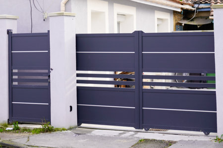 door modern steel aluminum gray gate portal and pedestrian door of suburb house facadeの写真素材
