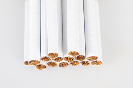 cigarette detailed with the paper wrapped around the tobacco harm of smoking cigarettes isolated on white backgroundの写真素材