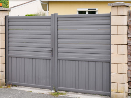Aluminum entrance fence modern home gray steel gate high portal of suburb house door facadeの写真素材